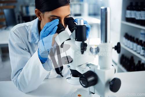 Image of Science, scientist and woman with microscope in laboratory for medical research, analysis and test. Healthcare, biotechnology and female chemist with equipment for study, sample and examine virus