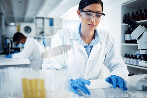 Image of Science, research and woman on tablet in laboratory for medical analysis, internet or online report. Healthcare, biotechnology and female scientist on digital tech for medicine, study or test results