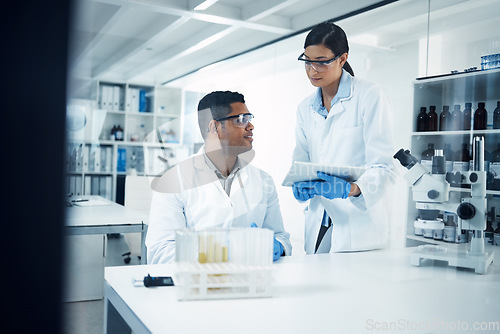 Image of Scientists, tablet and teamwork in research at lab for science data, discovery or results. Man and woman medical professional team working with technology for scientific experiment in the laboratory