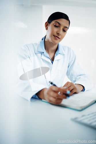 Image of Woman, scientist and writing in book for research in science discovery, breakthrough or information at lab. Female person or medical expert with notebook for scientific data or results in laboratory