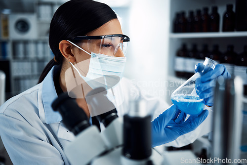 Image of Woman, scientist and analysis of chemical liquid, glass beaker and science chemistry experiment in lab. Female doctor with mask, gloves and study fluid, scientific innovation and medical research