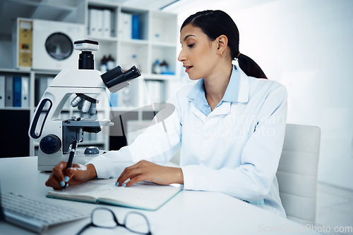 Image of Woman, scientist and writing notes in research for science discovery, breakthrough or information at lab. Female person or medical expert with notebook for scientific data or results in laboratory