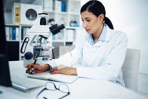 Image of Woman, scientist and writing in science research for discovery, breakthrough or information at lab. Female person or medical expert with notebook for medicine data, notes or results in laboratory