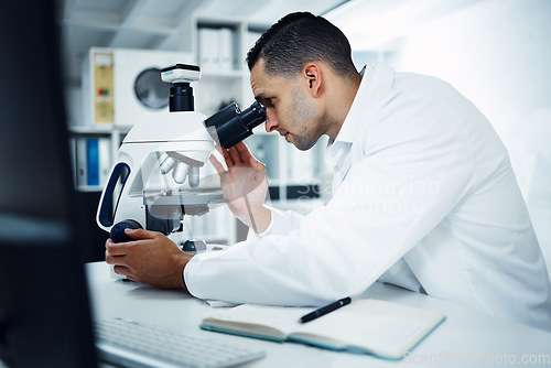 Image of Science, scientist and man with microscope in laboratory for medical research, analysis and dna test. Healthcare, biotechnology and male chemist with equipment for study, medicine sample and virus