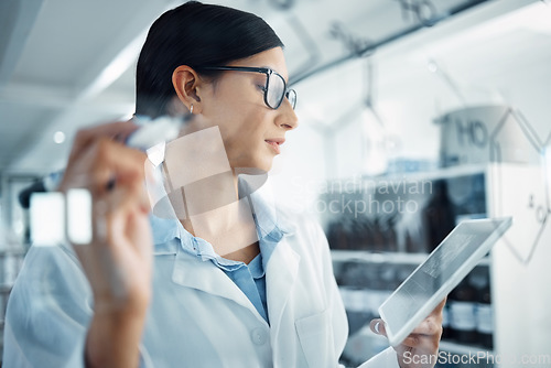 Image of Tablet, solution and woman scientist in a laboratory planning a science equation on a board. Technology, medical innovation and female researcher working on pharmaceutical project with digital mobile