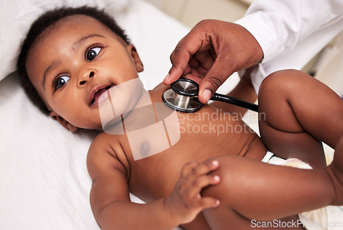 Image of African, little baby and stethoscope in bed for health checkup or pediatrician with infant or healthcare clinic and medical wellness. Child patient, cardiology and expert with toddler in hospital