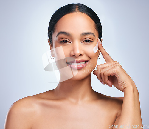 Image of Beauty cream, woman and portrait of skincare with dermatology and face cleaning. Wellness, lotion and young female model smile with skin glow product and treatment with care and moisturizer in studio