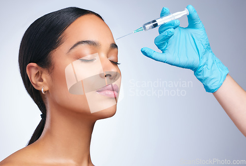 Image of Woman, studio and gloves for injection, surgery or cosmetics for skin, facial or collagen by white background. Girl cosmetic surgeon and filler on face, needle or hands for beauty, skincare or change