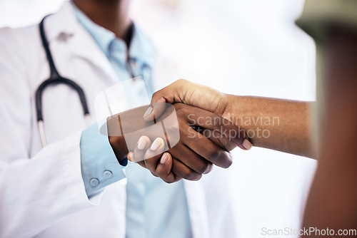 Image of Handshake, welcome and a doctor meeting a patient in the hospital for healthcare, insurance or medical treatment. Medicine, trust or thank you with a health professional shaking hands in a clinic