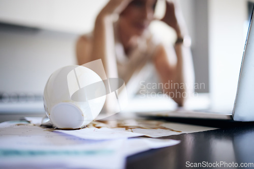 Image of Laptop, stress and woman spill coffee, mistake or accident in office workplace. Depression, spilling tea and documents, paperwork and person with headache, migraine and error, problem or clumsy.