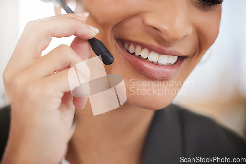 Image of Woman, call center and mouth or smile for customer service, support and telemarketing. Face closeup of african female agent or consultant with microphone for sales, crm or help desk for communication