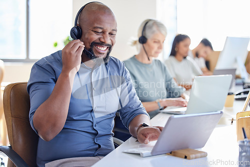 Image of Black man, laptop and call center agent smile or sales consultant or customer service worker for inbound support in the office. Face, happy African and male pc operator or outbound or telemarketing