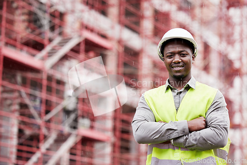 Image of Portrait of proud black man engineer, construction site and mockup with scaffolding in city, planning and safety. Smile, architect or project manager at building, urban engineering and arms crossed.