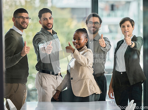 Image of Happy, success or portrait of business people with thumbs up or confidence in startup company office. Team success, thumb up or proud employees smiling with leadership or group support for growth