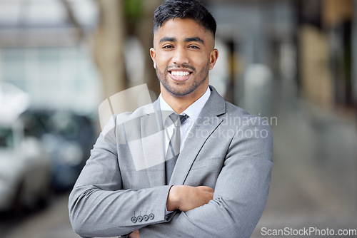 Image of Portrait, business and man with arms crossed, city and smile with startup success, ceo or executive director. Face, male person or employee in a suit, outdoor or skills with a career and professional