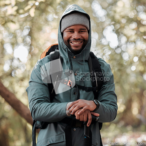 Image of Black man, portrait smile and hiking in nature for travel, adventure and journey in the outdoors. Happy African male person or hiker smiling in trekking, walk or hike for fitness, workout or exercise