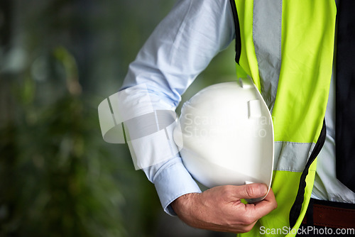 Image of Construction worker, hand and safety gear with helmet for engineering and architecture project. Outdoor, mockup and engineering employee hands with safety vest for architect job and expert work