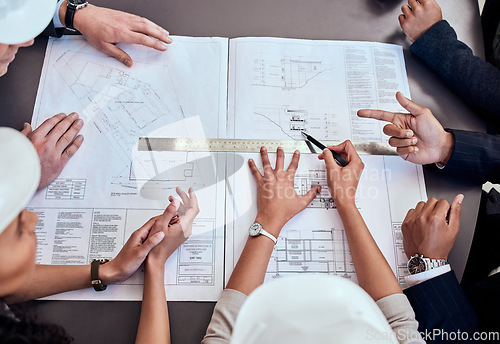 Image of Teamwork, architecture and blueprint with people in meeting for graphic, engineering and planning from above. Floor plans, documents and construction with designers for illustration and development