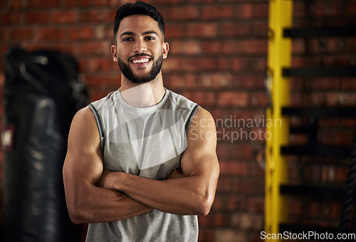 Image of Gym, smile and portrait of man with arms crossed, fitness and happiness in mockup space. Exercise, workout and happy face of bodybuilder, personal trainer or sports club owner for health, training.