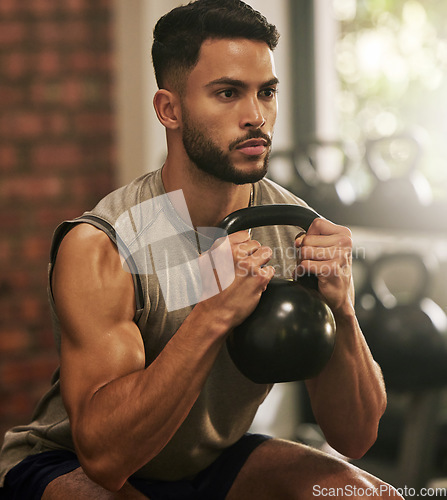 Image of Weightlifting, fitness and man squat with dumbbell in gym for exercise, bodybuilder training and workout. Sports, muscles and serious male person with weight for wellness, healthy body and strength
