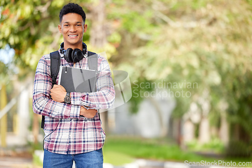 Image of Happy, ready and portrait of a man on campus for education, learning and knowledge with mockup space. Smile, university and a young male student with books in a college park to start studying