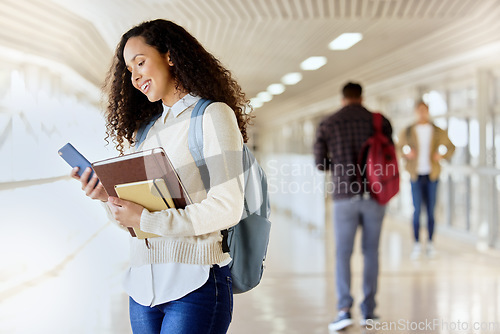 Image of College student, books and woman with a phone at school for social media communication. Happy african person with backpack while typing on smartphone at university for education, research or schedule