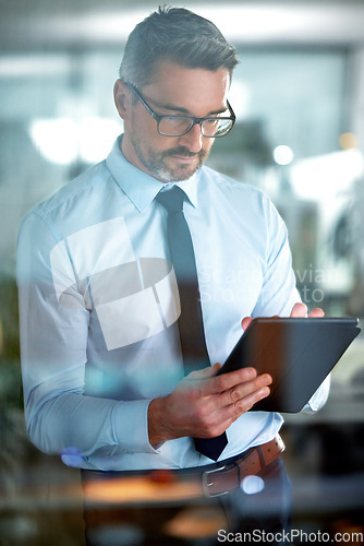 Image of Typing email, app and a businessman with a tablet for communication, connection and internet. Digital, working and a mature employee reading information, agenda or schedule on technology in office