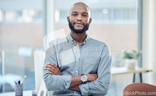 Image of Confidence, crossed arms and portrait of a businessman in the office with leadership and vision. Serious, career and professional African male hr manager sitting with a positive mindset in workplace.