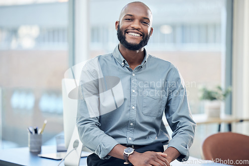 Image of Confidence, success and portrait of a businessman in the office with leadership and vision. Happy, smile and professional African male hr manager sitting with a positive mindset in the workplace.