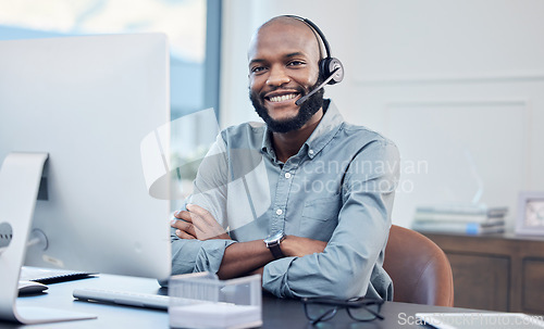 Image of Call center, headset and a black man at computer for customer service, crm or telemarketing. Smile portrait of African person, consultant or agent for sales, contact us and help desk for support