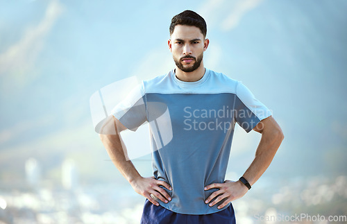 Image of Fitness, serious man and outdoor for a run or workout with hands on hip for motivation. Portrait of male athlete person or runner for cardio training, running or exercise for focus on wellness goals