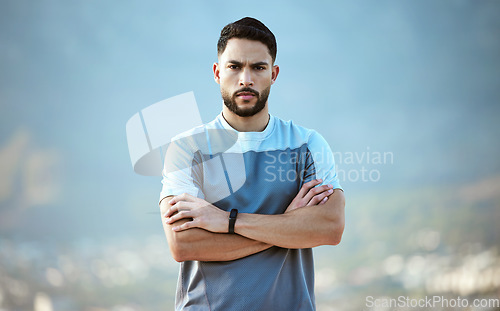 Image of Fitness, man and outdoor for a serious run or workout with arms crossed. Portrait of a male athlete person with focus and concentration for cardio training, running or health and wellness goals