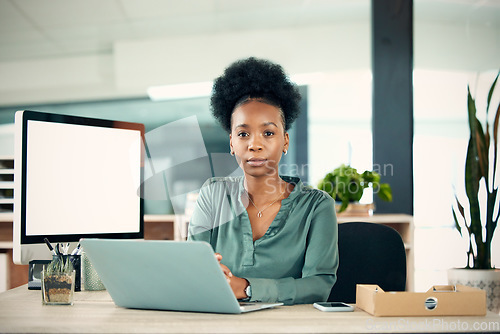 Image of Portrait, serious and black woman with laptop, writer and creative in office workplace. Computer, face and female entrepreneur, copywriter and professional from South Africa with business mockup.