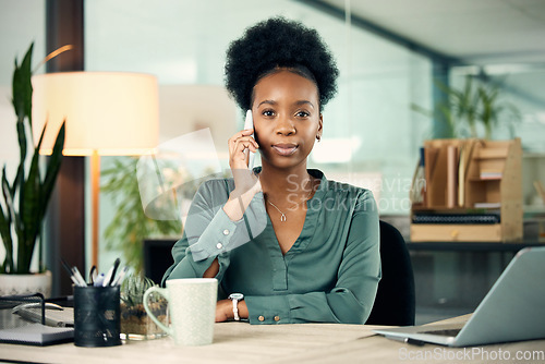 Image of Phone call, black woman and business portrait, serious or conversation with contact. Smartphone, face and African female professional talking, listening or communication in office workplace at night.