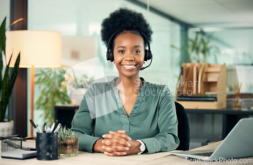 Image of Black woman, portrait and smile in call center for business, customer service or telemarketing in office. Contact us, face and African female sales agent, support consultant or professional at night.