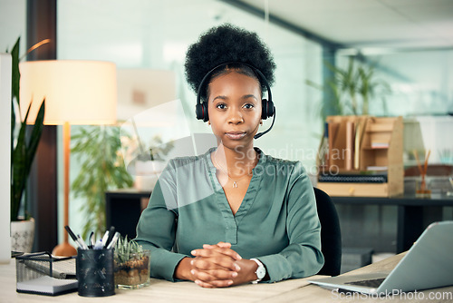 Image of Portrait, black woman and serious in call center for business, customer service or telemarketing in office. Contact us, face and African female sales agent, support consultant or professional at work