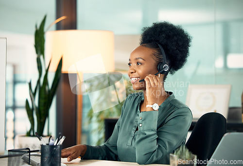 Image of Call center, black woman and smile for telemarketing, business or customer service in office for deadline. Contact us, crm and African female sales agent, support consultant or professional at night.