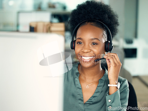 Image of Call center, smile of black woman and computer for telemarketing, customer service or business in office. Contact us, crm and happy African female sales agent, support consultant or professional.