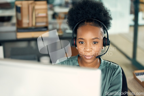 Image of Call center, black woman and computer for telemarketing, business or customer service in office. Contact us, crm and serious African female sales agent, support consultant or professional person.