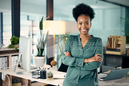 Image of Success, crossed arms and portrait of a businesswoman in her office with confidence and leadership. Corporate, professional and African female executive ceo with vision, ideas and goals in workplace.