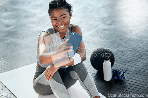 Image of African woman, gym selfie and floor for fitness, workout or wellness with smile for social media app. Influencer girl, photography or blog for exercise, performance and health for lifestyle in club