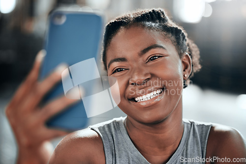 Image of Happy african woman, gym selfie and smile for fitness, workout and wellness on floor with social media app. Influencer girl, photography and blog for exercise, performance and health for lifestyle