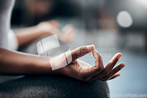 Image of Yoga in gym, hands or woman in meditation in lotus pose with zen peace or mindfulness in blurry studio. Closeup, chakra or relaxed girl in pilates exercise workout for spiritual wellness or self care