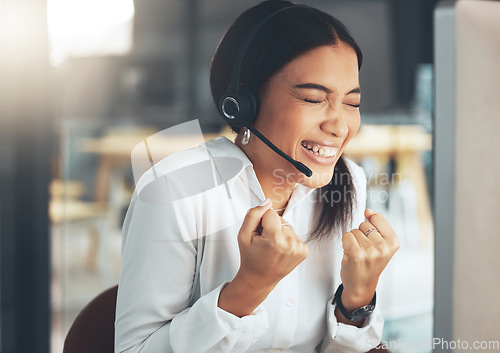 Image of Call center, customer service and celebration with a woman consultant in her office for support or assistance. CRM, contact us and cheering with a female employee consulting using a headset at work