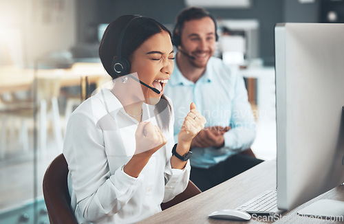 Image of Call center, customer service and cheering with a woman consultant in her office for support or assistance. CRM, contact us and celebration with a female employee consulting using a headset at work