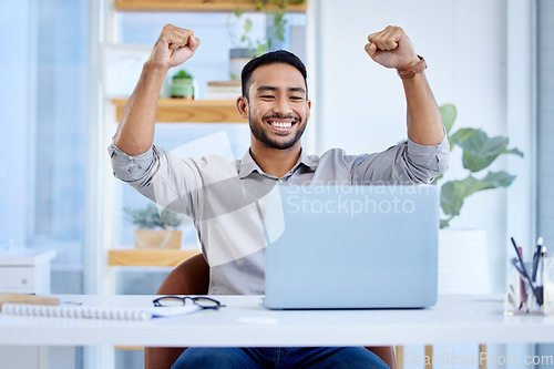 Image of Businessman, laptop and celebrate success or win at desk with fist for bonus deal. Excited Asian man or entrepreneur with tech for profit, competition or online achievement and loan notification