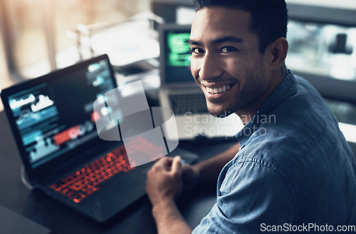 Image of Portrait, man and smile of programmer on computer in office workplace at night. IT, face and male coder or person programming, coding and writing for software development or information technology.