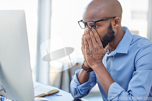 Image of Mental health, businessman with stress and with computer at his desk of his office workplace. Anxiety or depressed, problem or mistake and burnout male person at his pc at his modern workspace