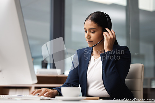 Image of Computer, telemarketing and woman typing in call center office for customer service, help desk or technical support. Crm, contact us and female sales agent, business consultant or employee listening.