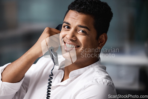 Image of Landline, portrait and happy business man in office talking, smile and sales contact for networking. Telephone, conversation and face of male person on call, consulting or telemarketing discussion